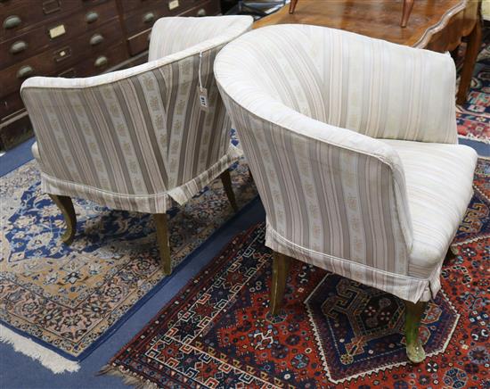 A pair of gilt framed tub chairs